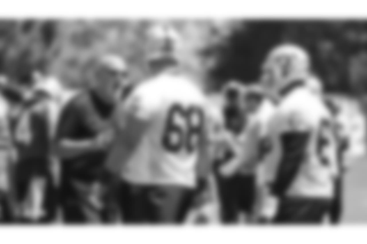Oakland Raiders offensive line coach Tom Cable, tackle Breno Giacomini (68), and offensive guard Gabe Jackson (66) at an Organized Team Activity (OTA) at the Oakland Raiders Practice Facility, Monday, June 4, 2018, in Alameda, California.