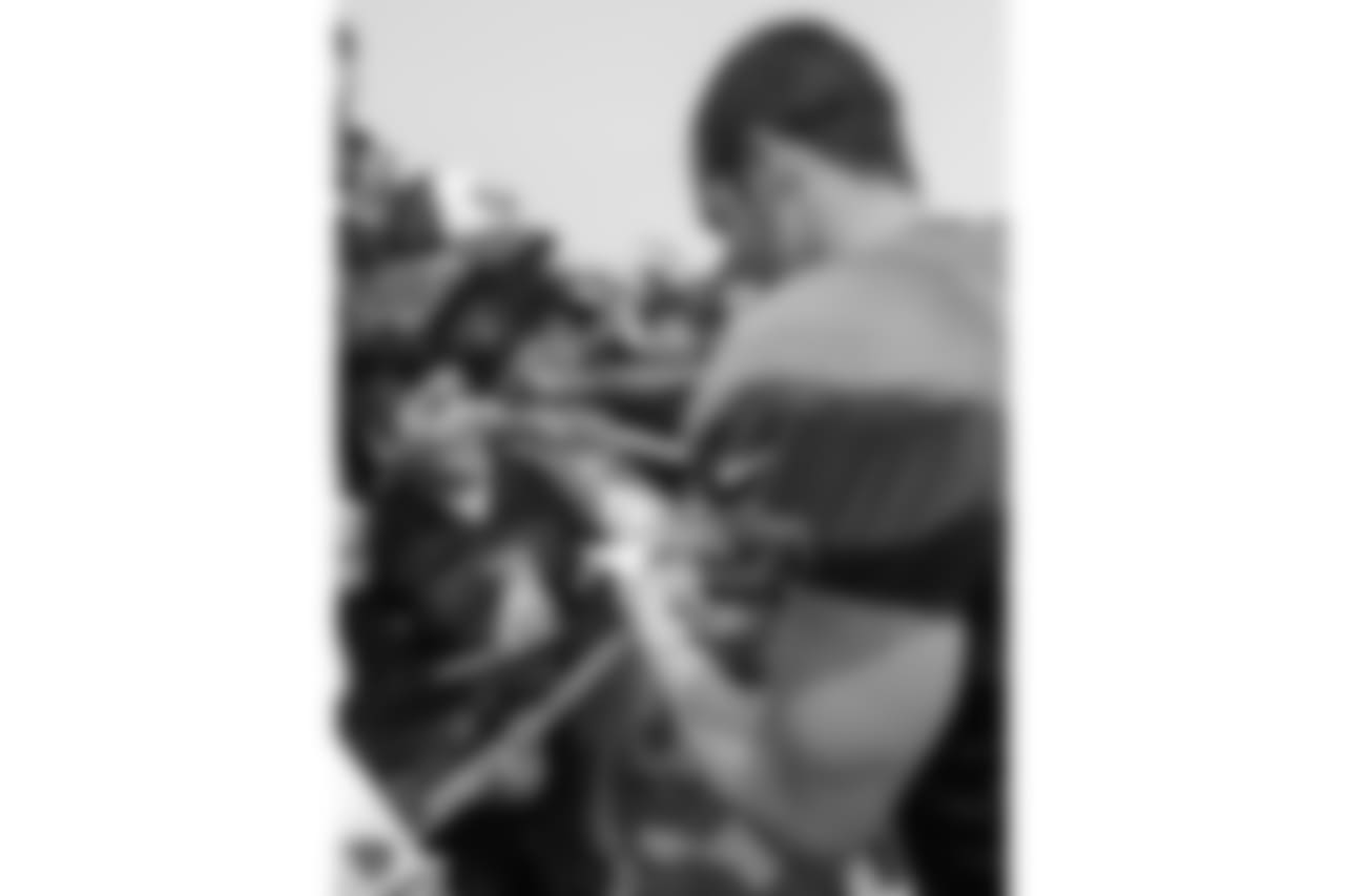 Oakland Raiders quarterback Derek Carr (4) signs autographs for fans after practice at 2018 Training Camp at The Oakland Raiders Napa Valley Training Complex, Wednesday, August 8, 2018, in Napa, California.