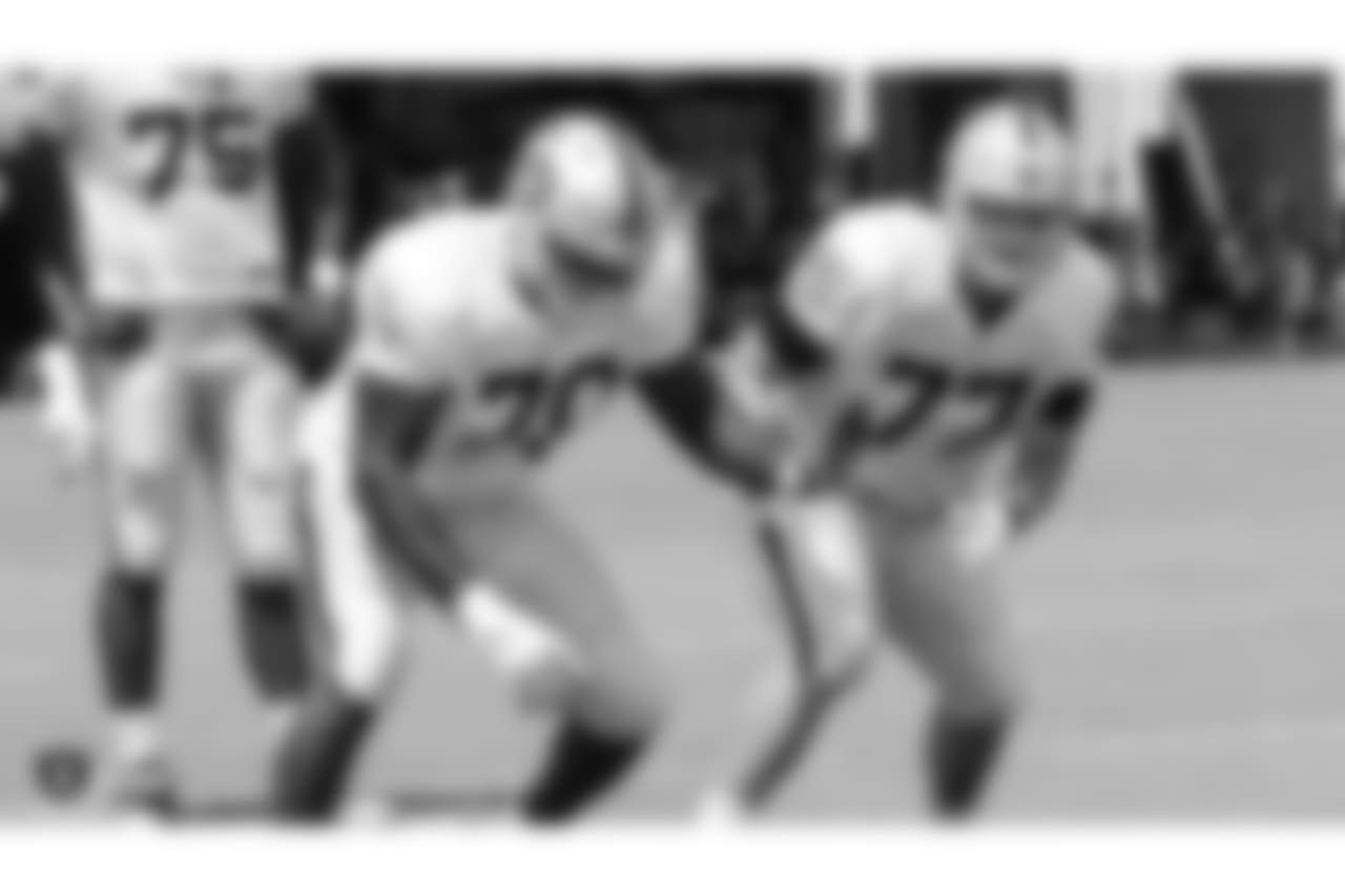 Oakland Raiders offensive guard Kelechi Osemele (70) and offensive tackle Kolton Miller (77) on the field for practice at 2018 Training Camp at The Oakland Raiders Napa Valley Training Complex, Monday, July 30, 2018, in Napa, California.