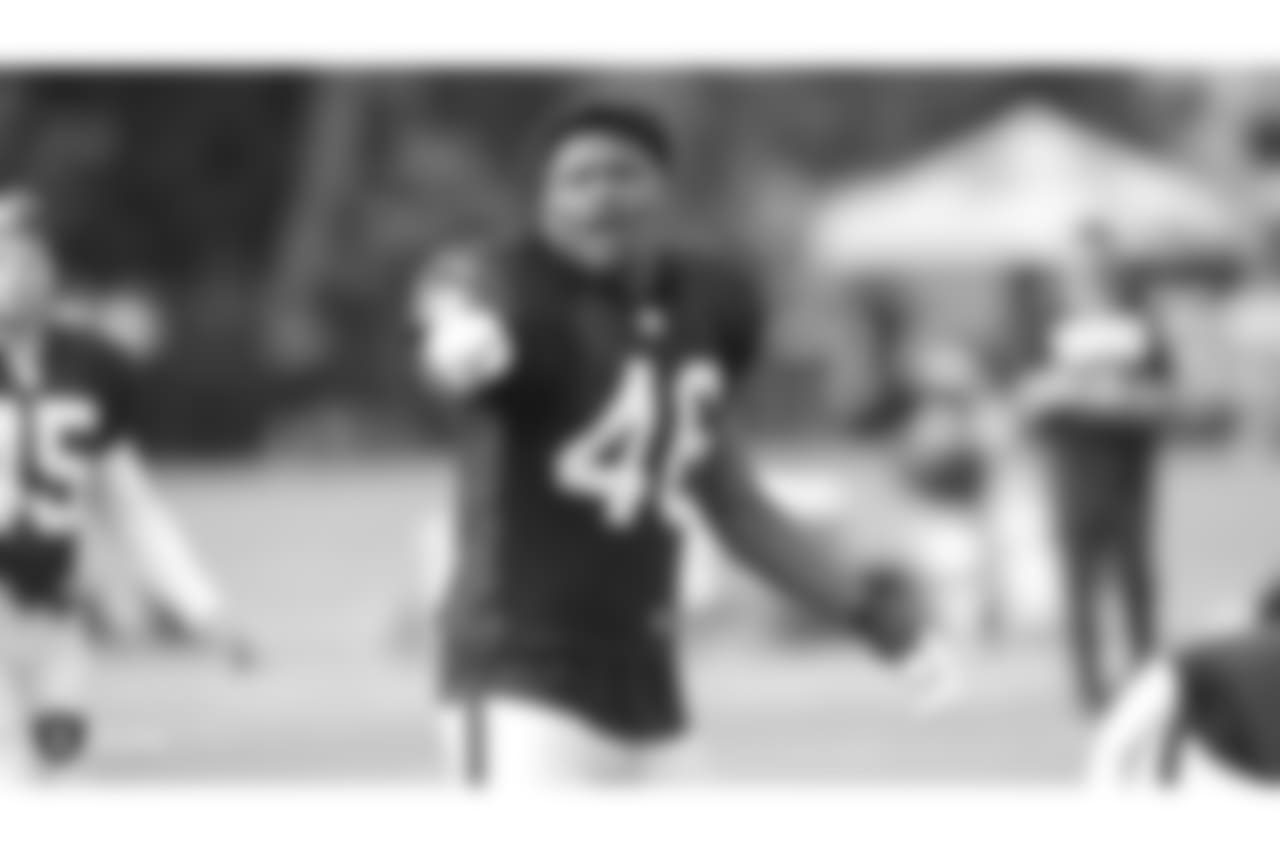 Oakland Raiders linebacker Jason Cabinda (46) and coaches on the field for practice at 2018 Training Camp at The Oakland Raiders Napa Valley Training Complex, Wednesday, August 1, 2018, in Napa, California.