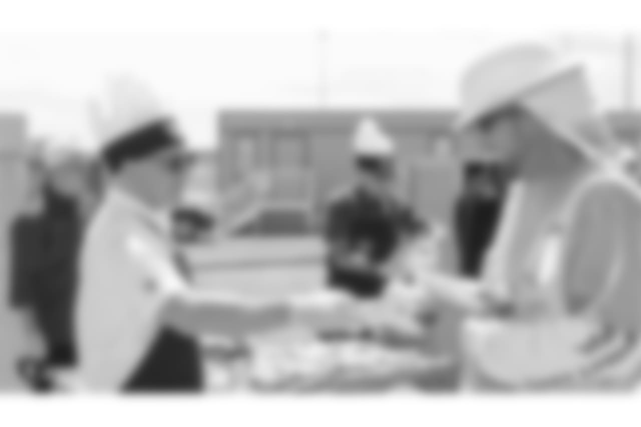 Oakland Raiders president, Marc Badain, and other staff members from The Oakland Raiders front office spend the day with construction workers of the Las Vegas Stadium worksite by handing out lunches and sharing a meal, Wednesday, June 28, 2018, at the Las Vegas Stadium worksite in Las Vegas, Nevada.