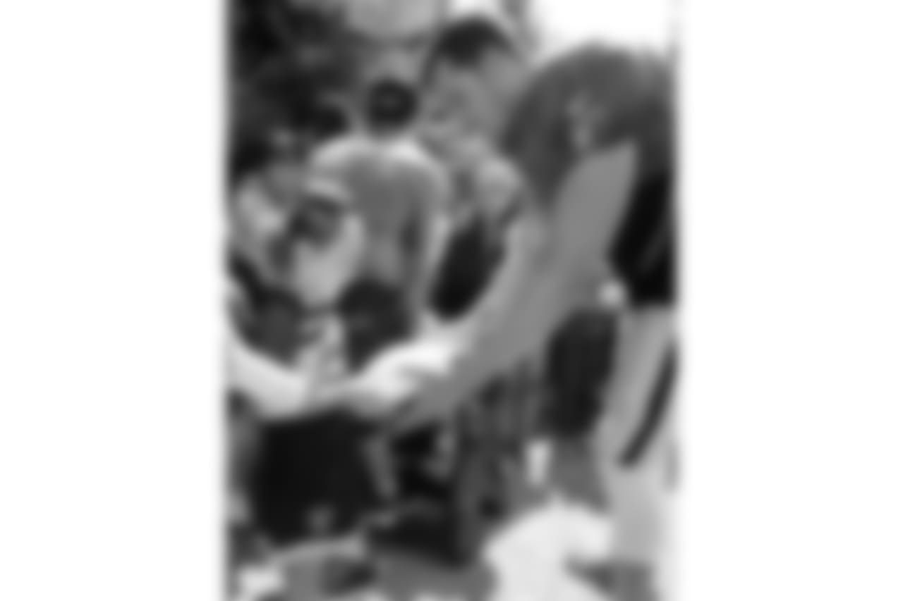 Oakland Raiders quarterback Derek Carr (4) signs autographs for fans after practice at 2018 Training Camp at The Oakland Raiders Napa Valley Training Complex, Thursday, August 2, 2018, in Napa, California.