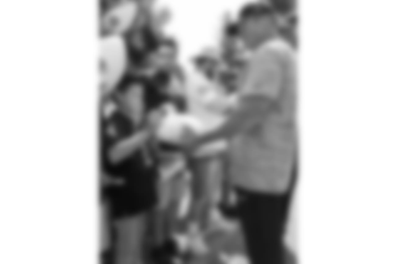 Oakland Raiders head coach Jon Gruden sign autographs for fans after practice at 2018 Training Camp at The Oakland Raiders Napa Valley Training Complex, Thursday, August 2, 2018, in Napa, California.