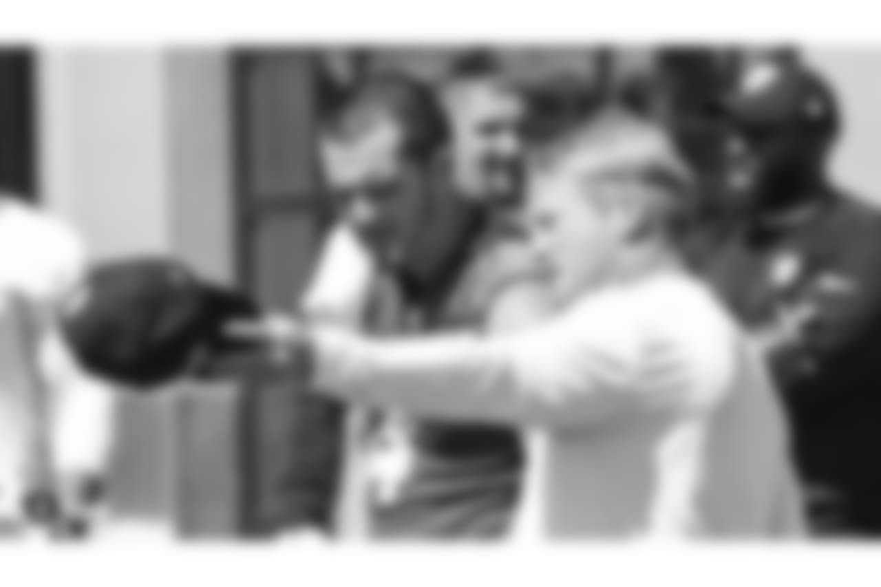 Oakland Raiders head coach Jon Gruden and quarterback Derek Carr (4) at an Organized Team Activity (OTA) at the Oakland Raiders Practice Facility, Tuesday, May 29, 2018, in Alameda, California.