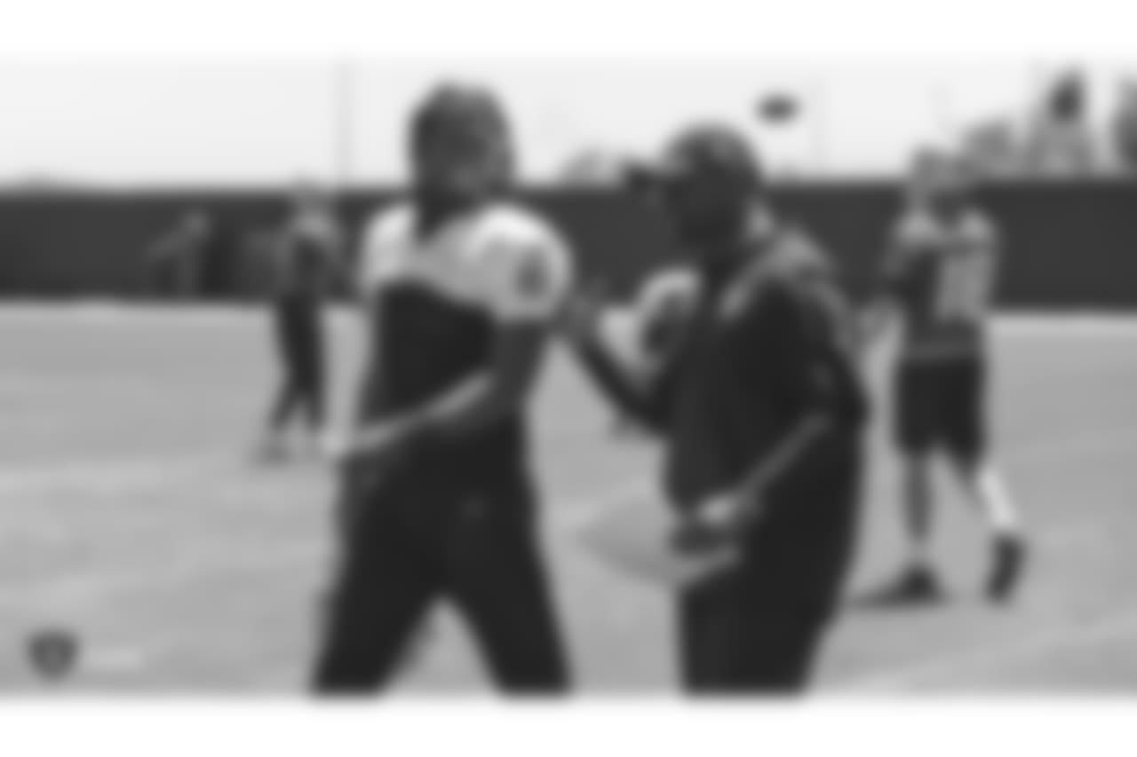 Oakland Raiders wide receiver Martavis Bryant (12) and wide receivers coach Edgar Bennett at a Mandatory Minicamp at the Oakland Raiders Practice Facility, Wednesday, June 13, 2018, in Alameda, California.