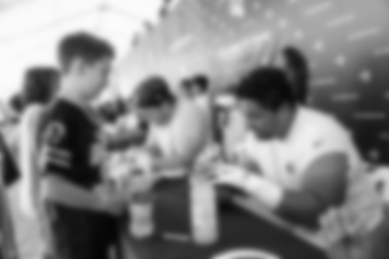 Offensive guard (61) Jeremiah Kolone of the Los Angeles Rams signs autographs during Day 6 of Training Camp, Wednesday, August 01, 2018, in Irvine, CA. (Will Navarro/Rams)