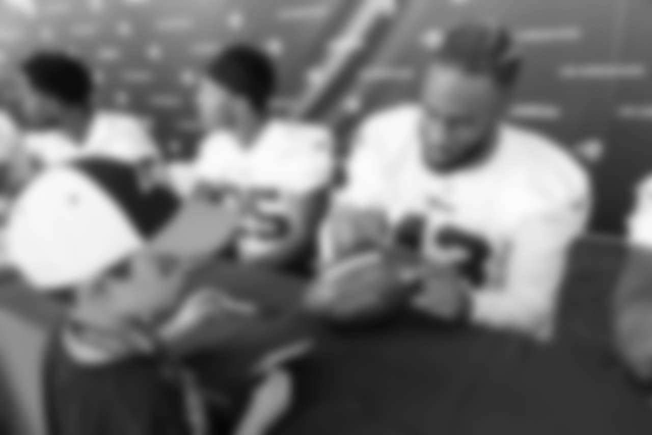 Safety (43) John Johnson III of the Los Angeles Rams signs autographs during Day 3 of Training Camp, Saturday, July 28, 2018, in Irvine, CA. (Will Navarro/Rams)