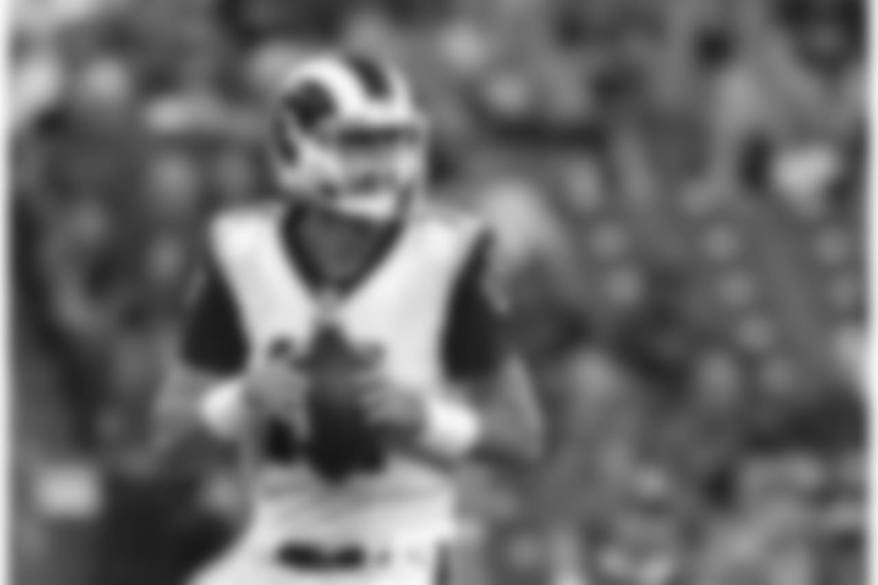 Los Angeles Rams quarterback Sean Mannion looks for a reeiver in the first half of a preseason NFL football game against the Baltimore Ravens, Thursday, Aug. 9, 2018, in Baltimore. (AP Photo/Gail Burton)