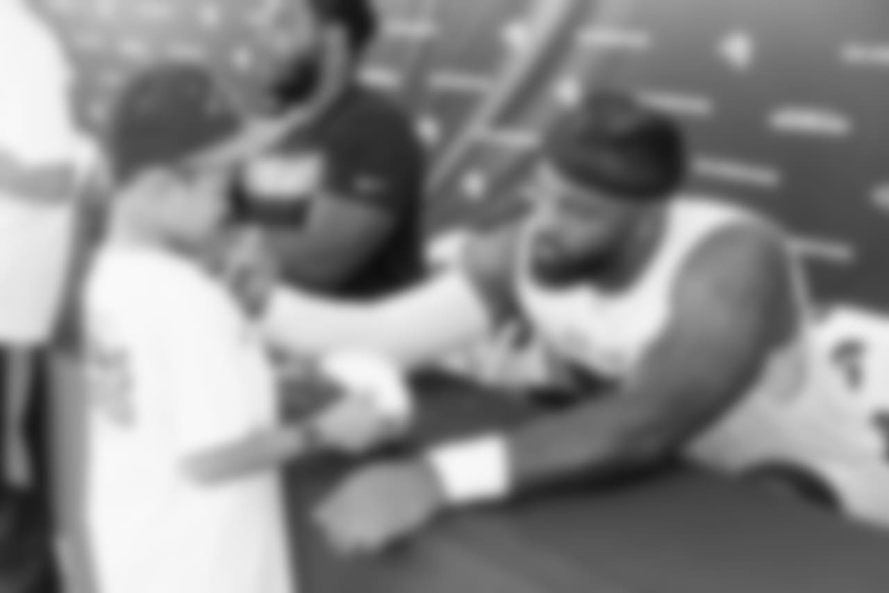 Defensive lineman (90) Michael Brockers of the Los Angeles Rams signs autographs during Day 5 of Training Camp, Monday, July 30, 2018, in Irvine, CA. (Will Navarro/Rams)