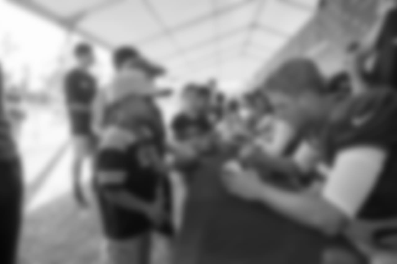 Quarterback (16) Jared Goff of the Los Angeles Rams signs autographs after practice on Day 4 of Training Camp, Sunday, July 29, 2018, in Irvine, CA. (Jeff Lewis/Rams)