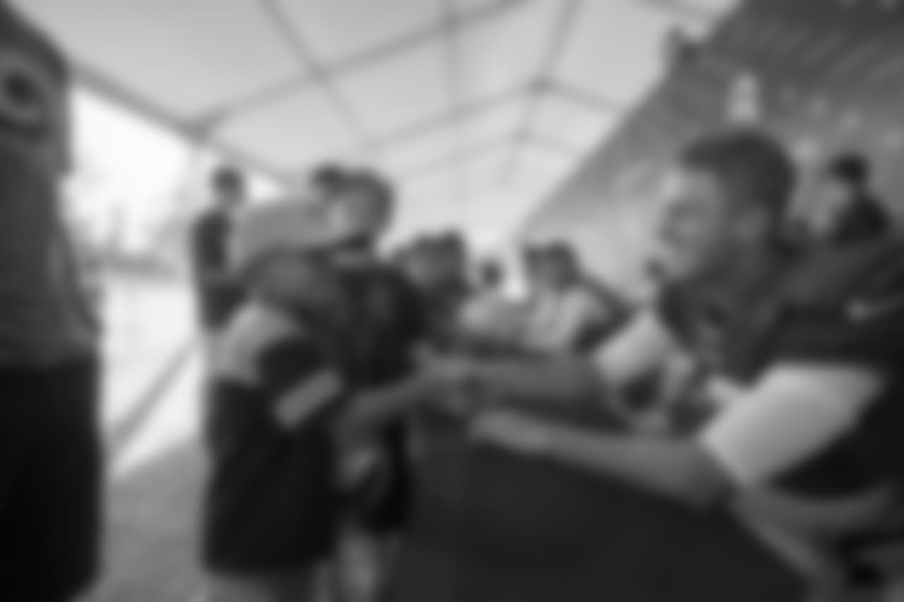 Quarterback (16) Jared Goff of the Los Angeles Rams signs autographs after practice on Day 4 of Training Camp, Sunday, July 29, 2018, in Irvine, CA. (Jeff Lewis/Rams)