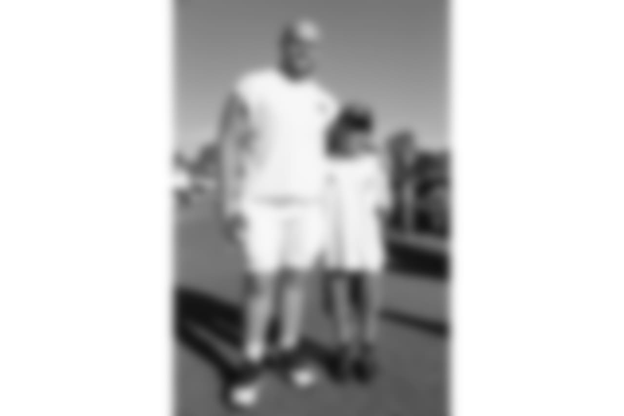 Center (55) Brian Allen of the Los Angeles Rams takes a photo with fans during Day 6 of Training Camp, Wednesday, August 01, 2018, in Irvine, CA. (Will Navarro/Rams)