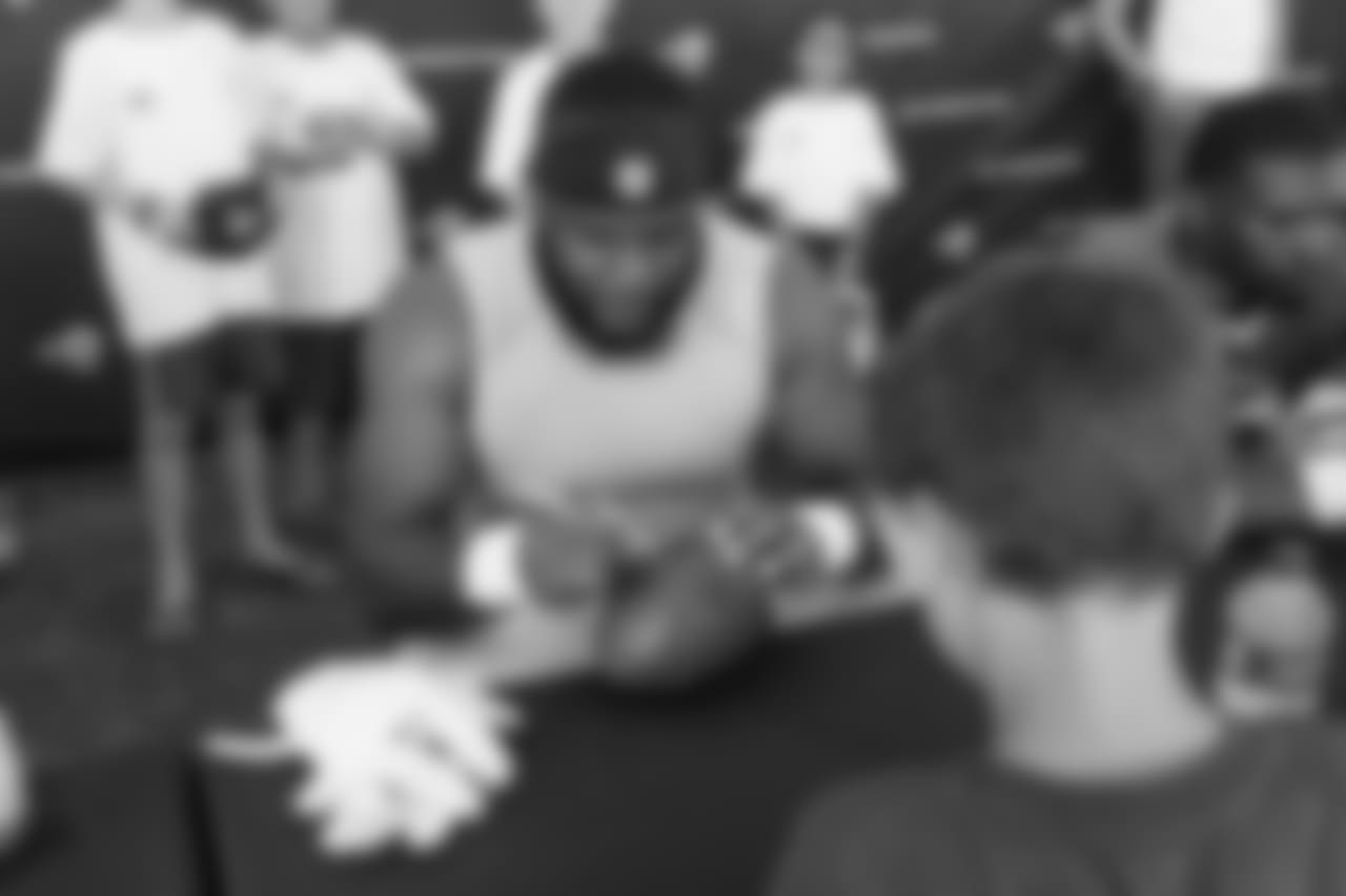 Defensive tackle (94) Omarius Bryant of the Los Angeles Rams signs autographs during Day 5 of Training Camp, Monday, July 30, 2018, in Irvine, CA. (Will Navarro/Rams)