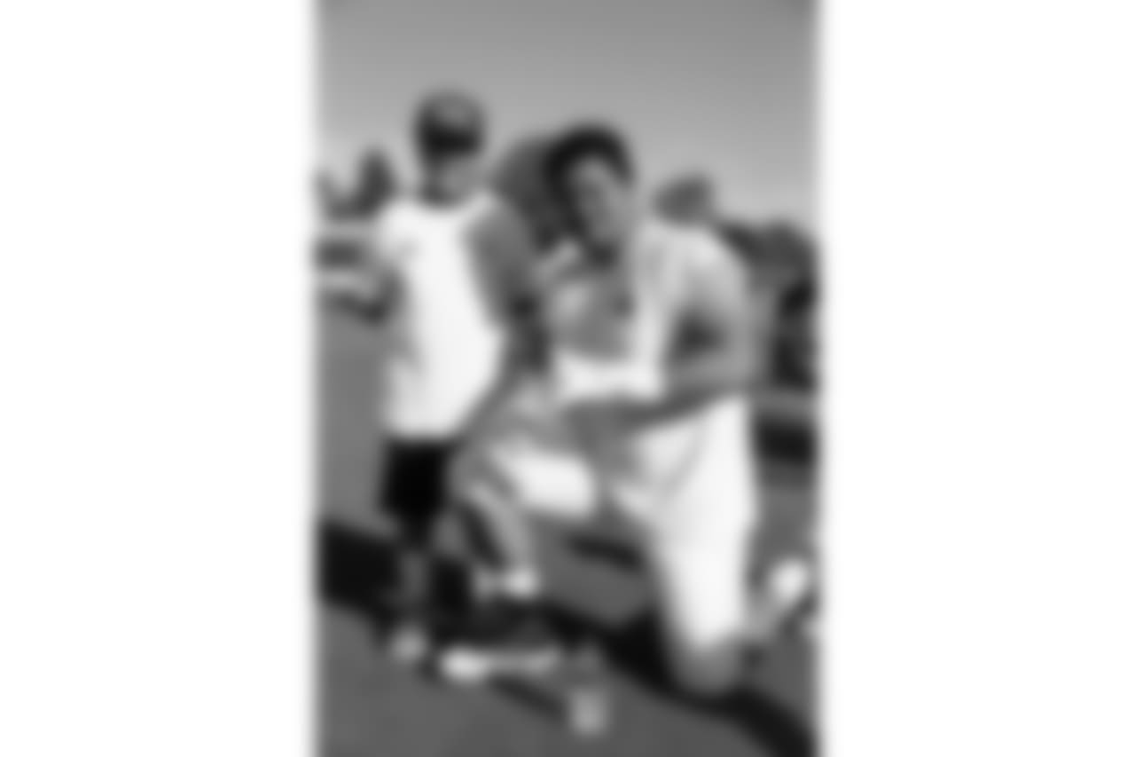 Offensive guard (61) Jeremiah Kolone of the Los Angeles Rams takes a photo with fans during Day 6 of Training Camp, Wednesday, August 01, 2018, in Irvine, CA. (Will Navarro/Rams)