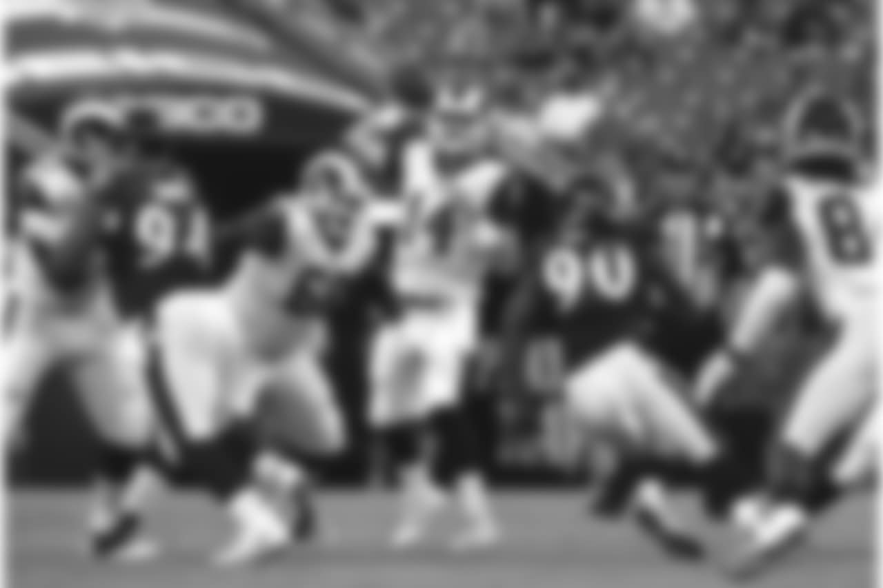 Los Angeles Rams quarterback Sean Mannion (14) throws to a receiver in the first half of a preseason NFL football game against the Baltimore Ravens, Thursday, Aug. 9, 2018, in Baltimore. (AP Photo/Gail Burton)