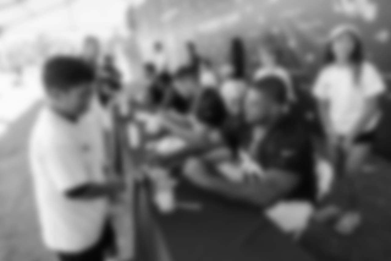 Offensive Guard (76) Rodger Saffold of the Los Angeles Rams signs autographs during Day 6 of Training Camp, Wednesday, August 01, 2018, in Irvine, CA. (Will Navarro/Rams)