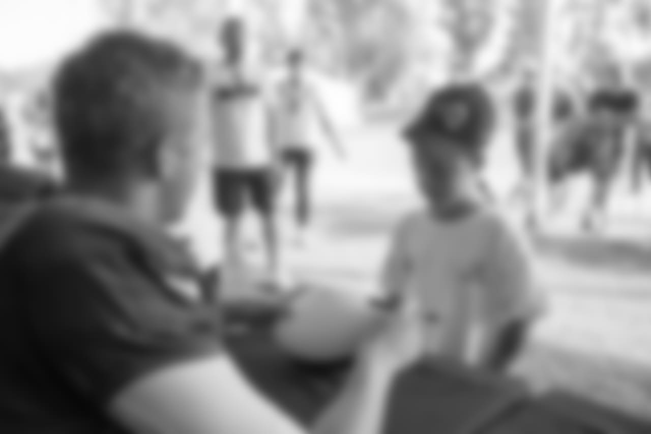 Quarterback (16) Jared Goff of the Los Angeles Rams signs autographs after practice on Day 4 of Training Camp, Sunday, July 29, 2018, in Irvine, CA. (Jeff Lewis/Rams)