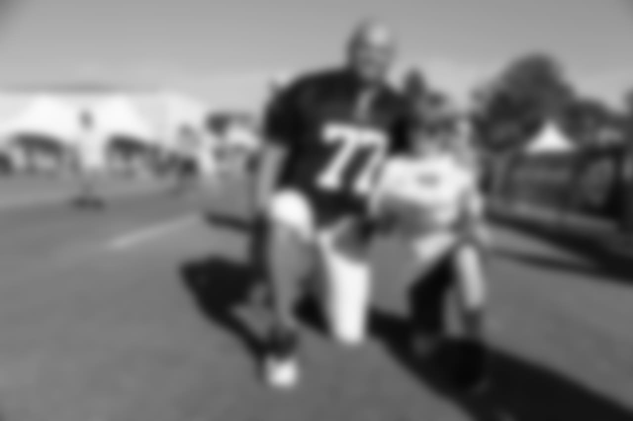 Offensive tackle (77) Andrew Whitworth of the Los Angeles Rams takes a photo with fans during Day 6 of Training Camp, Wednesday, August 01, 2018, in Irvine, CA. (Will Navarro/Rams)
