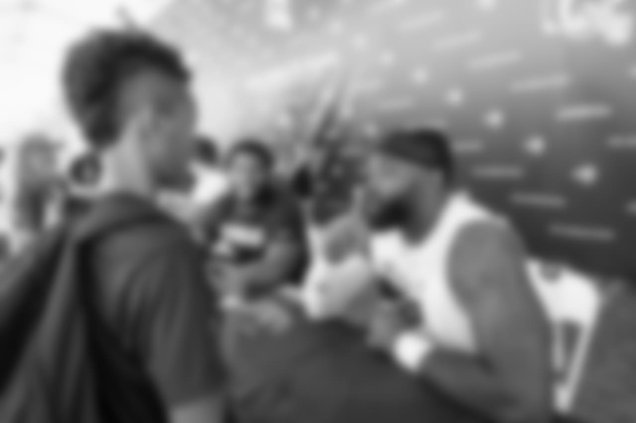 Defensive lineman (90) Michael Brockers of the Los Angeles Rams signs autographs during Day 5 of Training Camp, Monday, July 30, 2018, in Irvine, CA. (Will Navarro/Rams)