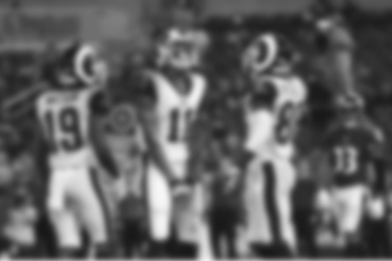 Los Angeles Rams wide receiver Khadarel Hodge (11) celebrates his touchdown with teammates JoJo Natson, left, and Mike Thomas in the second half of a preseason NFL football game against the Baltimore Ravens, Thursday, Aug. 9, 2018, in Baltimore. (AP Photo/Gail Burton)