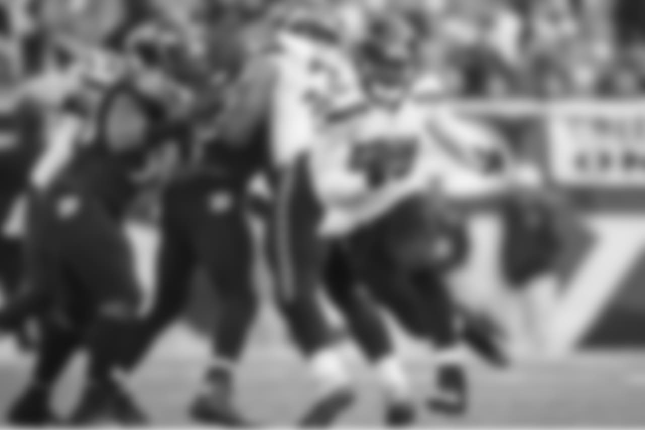 Derrick Coleman sprints upfield for a 19-yard gain as teammates Cooper Helfet and Garry Gilliam seal off Baltimore defenders.