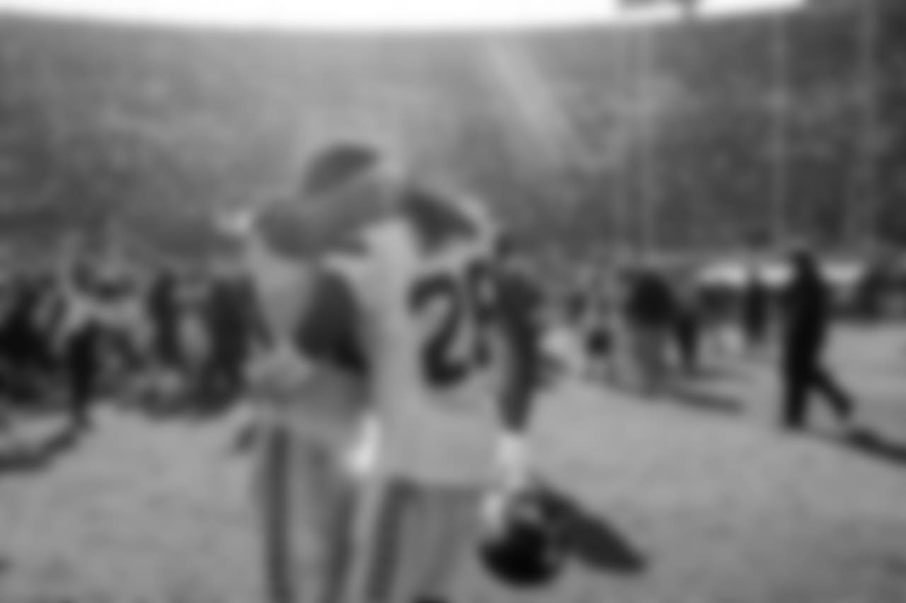 Rooke cornerback Shaquill Griffin is hugged by veteran safety Earl Thomas on the field after the hard-fought victory.