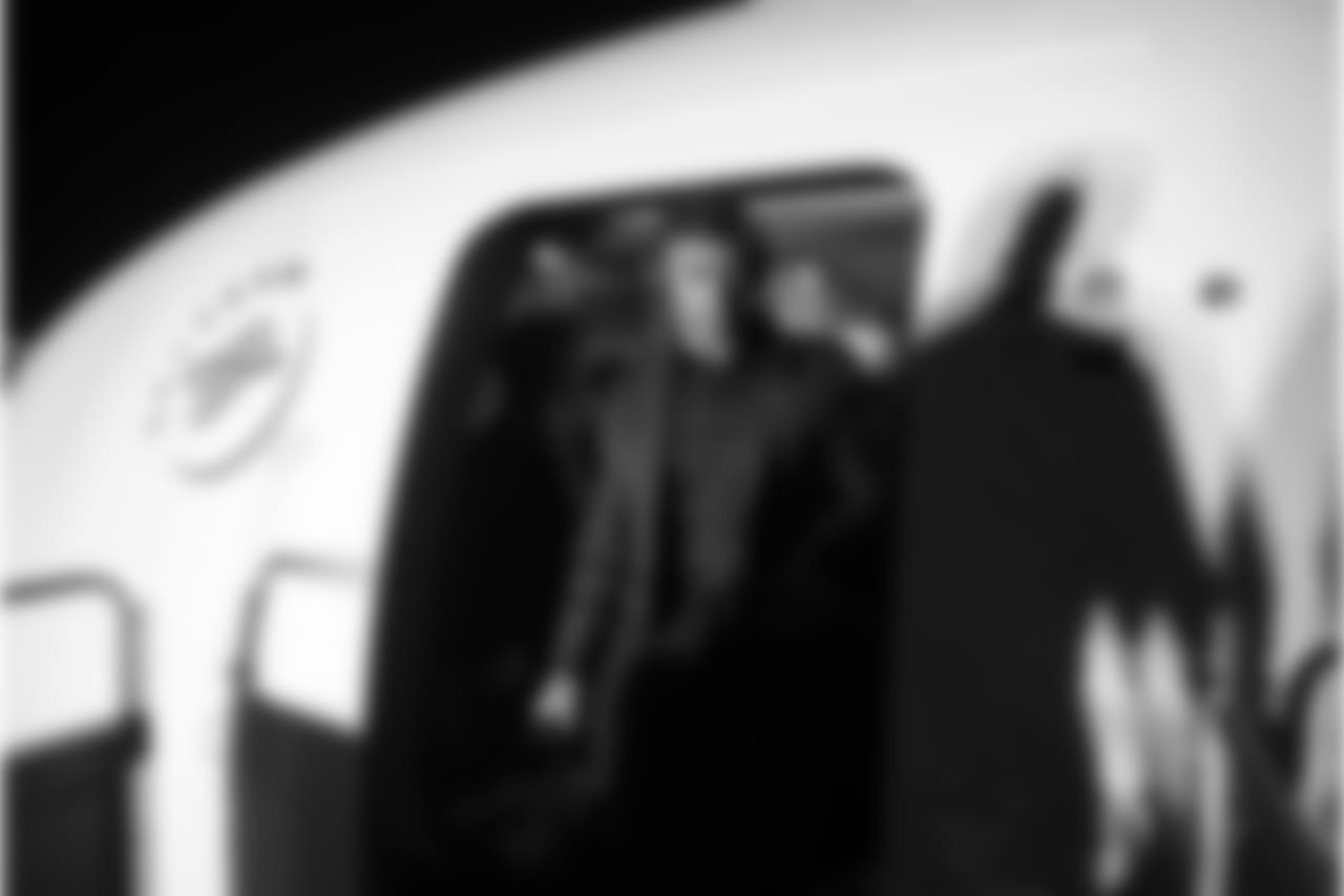 Quarterback Russell Wilson steps off the Delta charter flight upon arrival in Baltimore late Friday evening.