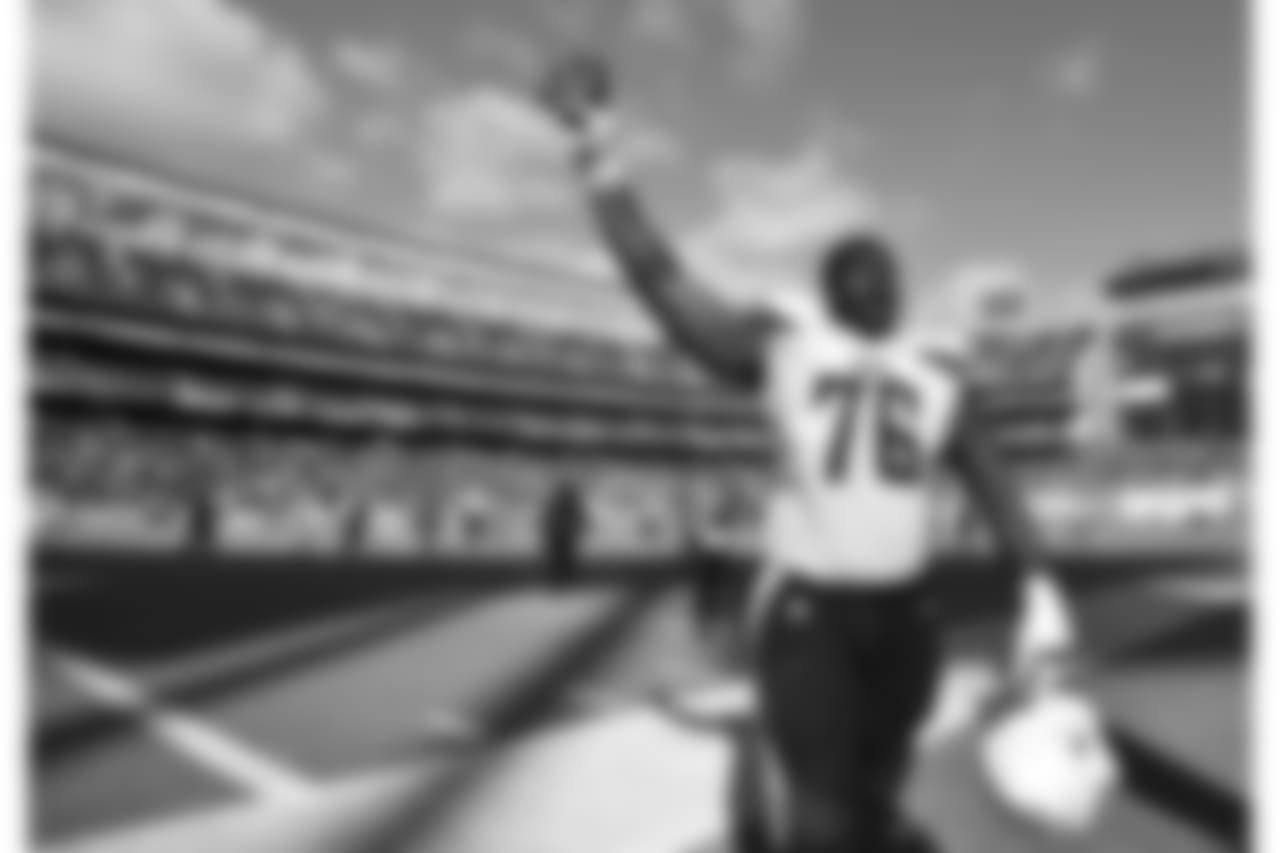 San Diego Chargers tackle D.J. Fluker celebrates after the Chargers defeated the Jacksonville Jaguars 33-14 in an NFL football game Sunday, Sept. 28, 2014 in San Diego. (AP Photo/Denis Poroy)