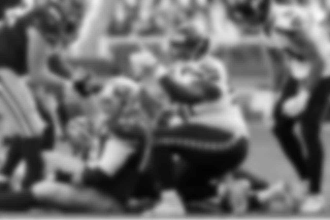Defensive tackle Jarran Reed points after making a tackle for loss.