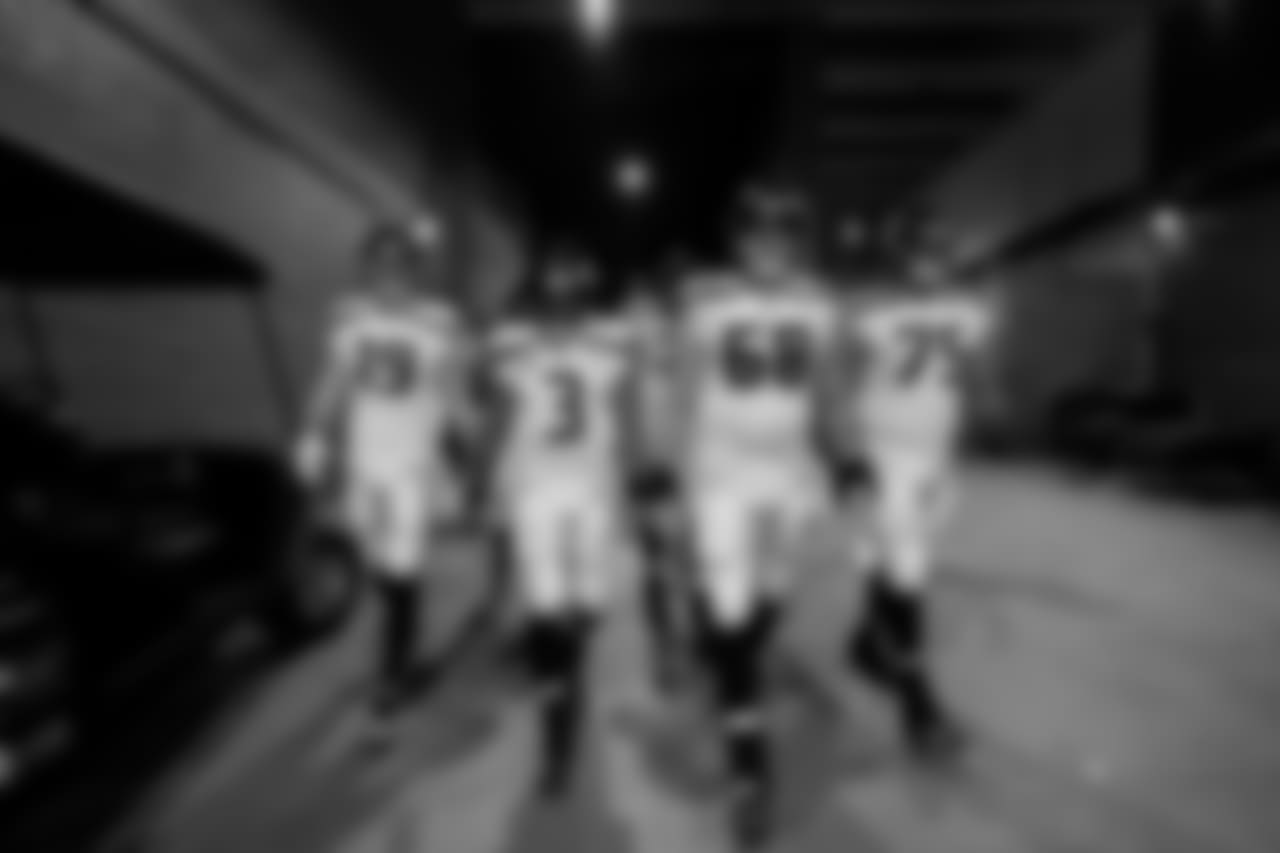 From left, Tanner McEvoy, Russell Wilson, Justin Britt and Oday Aboushi lead the Seahawks to the playing field.