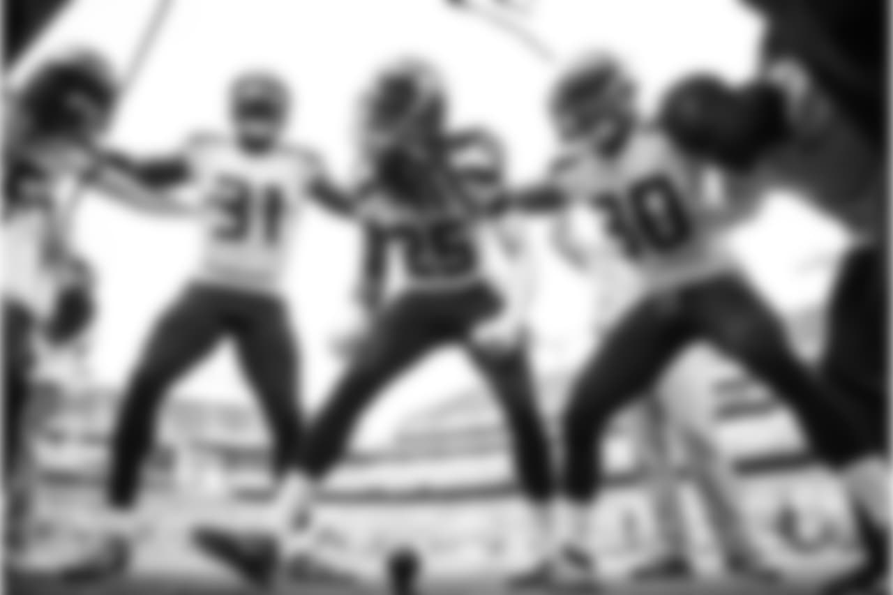 Richard Sherman fires up the defensive backs in their pregame huddle on the field at M&T Stadium.