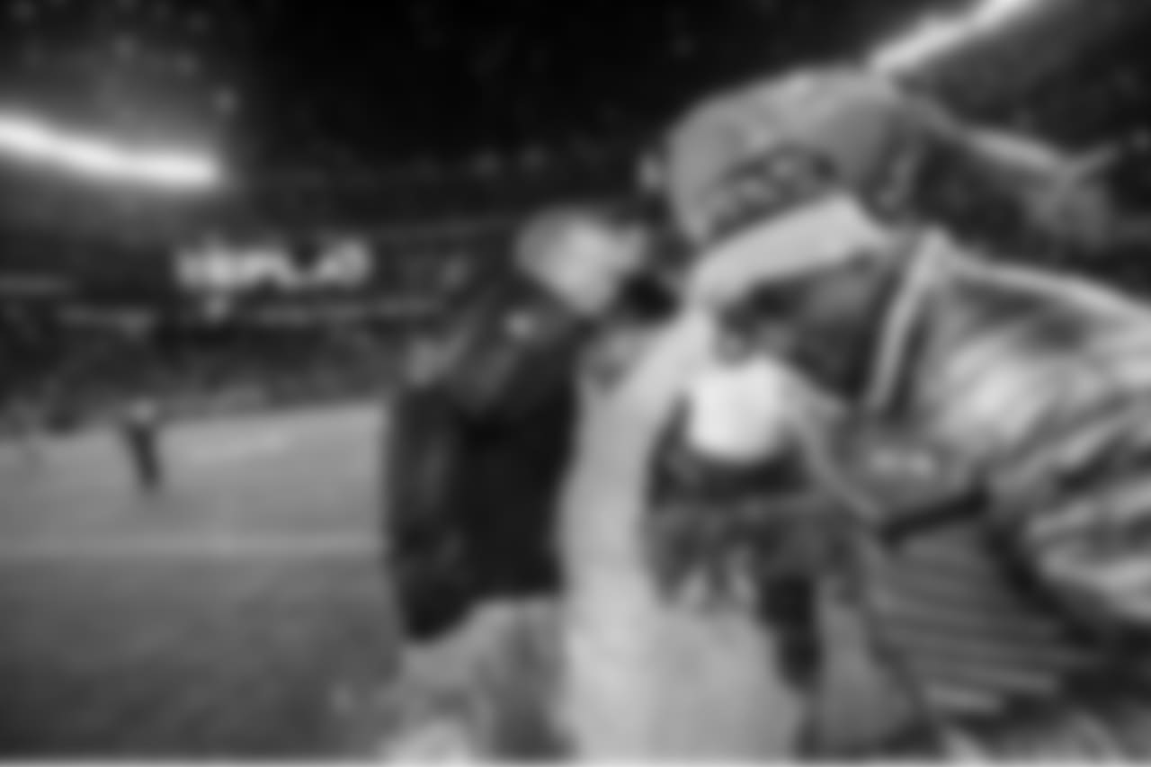 The sign said "REPLAY" And as if one bath wasn't enough, moments later Pete Carroll was doused once again as defensive back Akeem Auguste leaps out of the way.