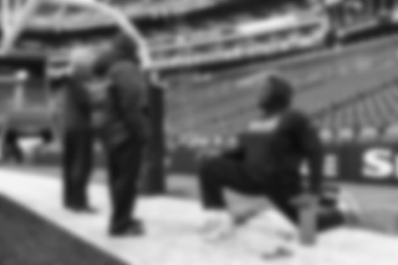 On the field, offensive tackle Germain Ifedi gets loose during early pregame warmups.
