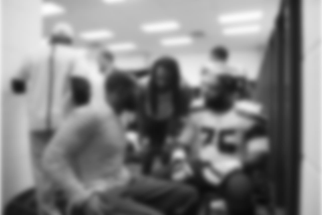 In the Seahawks postgame locker room, Kam Chancellor chats with Richard Sherman and Russell Okung.