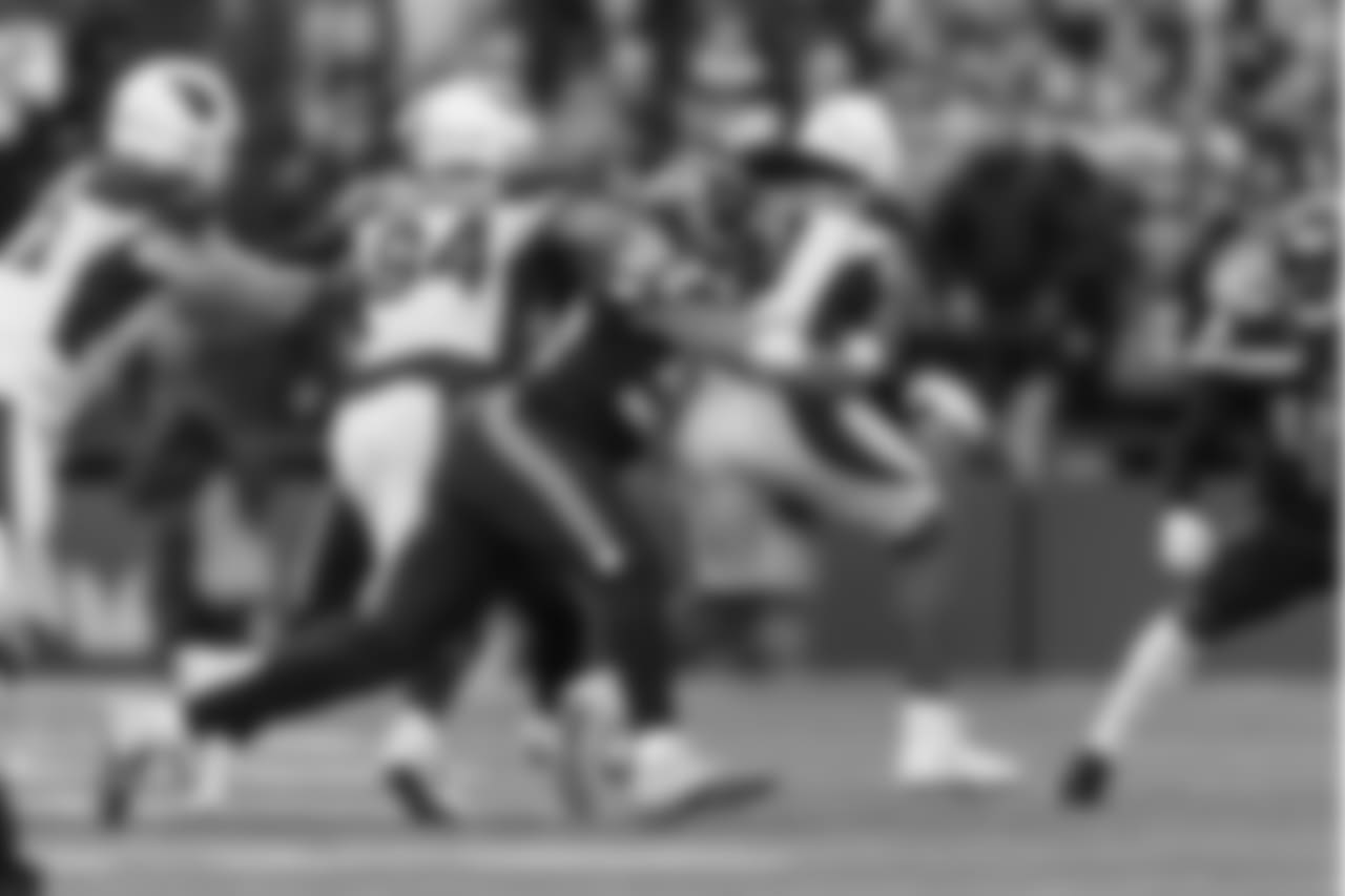 Seattle's K.J. Wright corrals Arizona receiver Larry Fitzgerald during the first quarter.