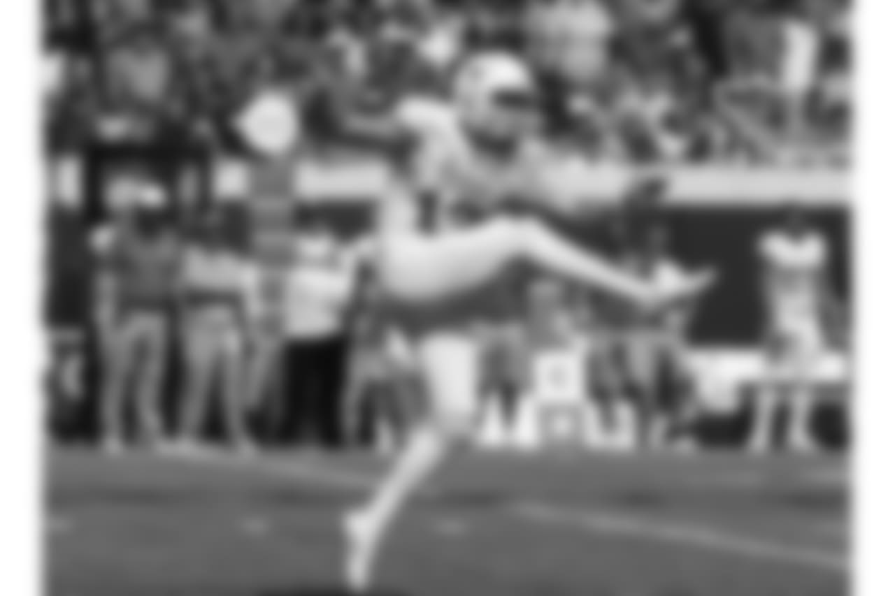 Texas punter Michael Dickson (13) kicks during an NCAA college football game between Texas and Oklahoma State in Stillwater, Okla., Monday, Oct. 3, 2016. Oklahoma State won 49-31. (AP Photo/Sue Ogrocki)