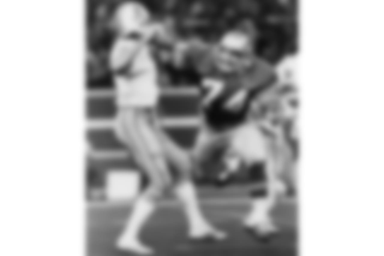Seattle Seahawks rookie defensive tackle Manu Tuiasosopo (74) pressures Houston Oilers quarterback Dan Pastorini (7) during an NFL game in Seattle, Wash., Oct. 21, 1979. The Seahawks defeated the Oilers 34-14. (AP Photo/NFL Photos)