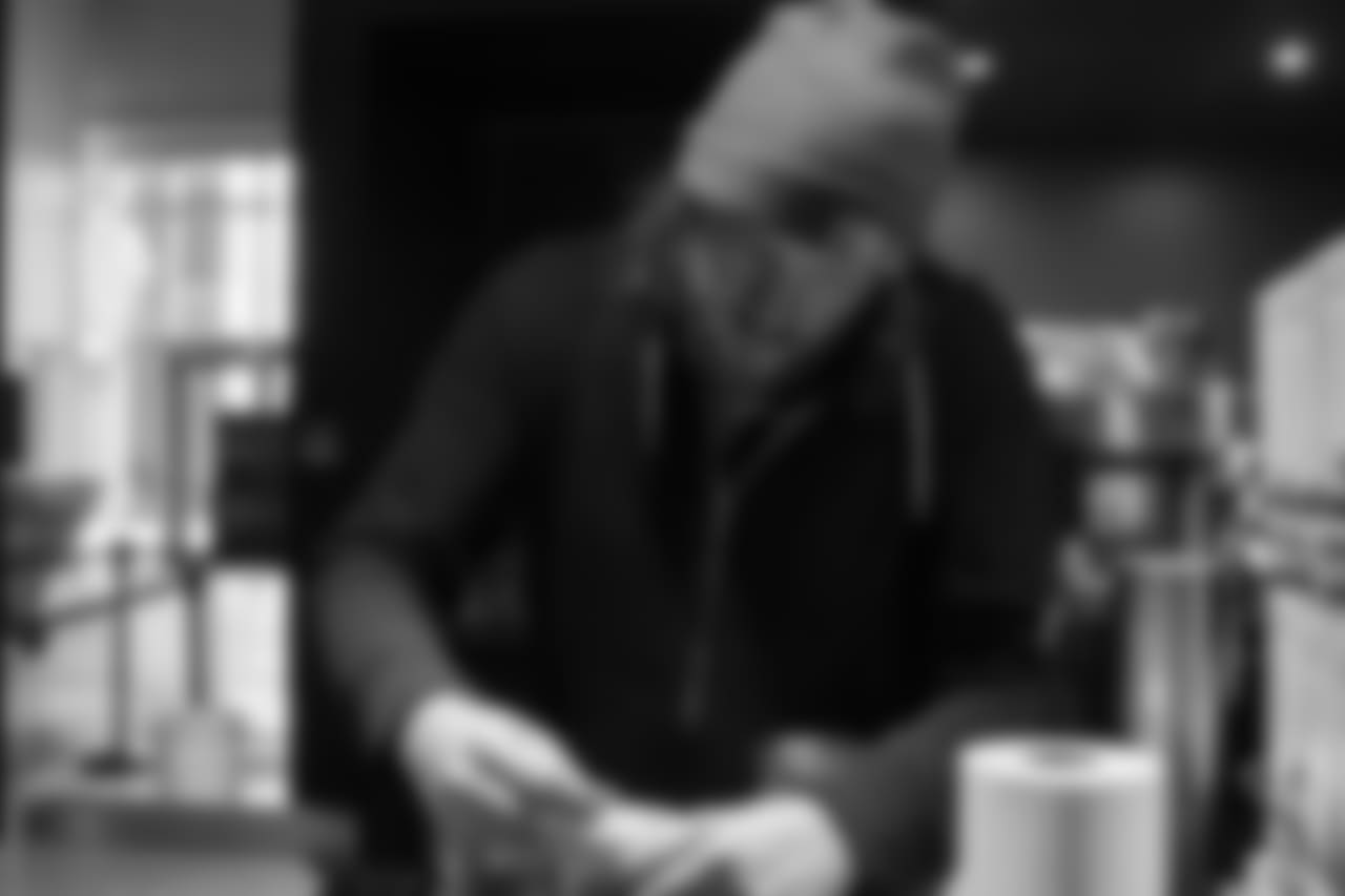 Latte artist Kale Lotton works on a latte logo for the Seahawks schedule release video.