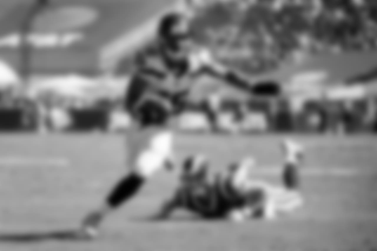 Tyler Lockett looks for more yardage after evading the Rams' Cody Davis.