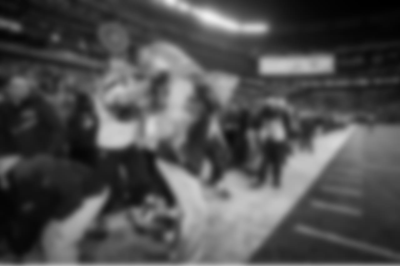 Head coach Pete Carroll gets the first drops of the traditional Gatorade bath courtesy of Zach Miller and Russell Wilson at the end of the game.