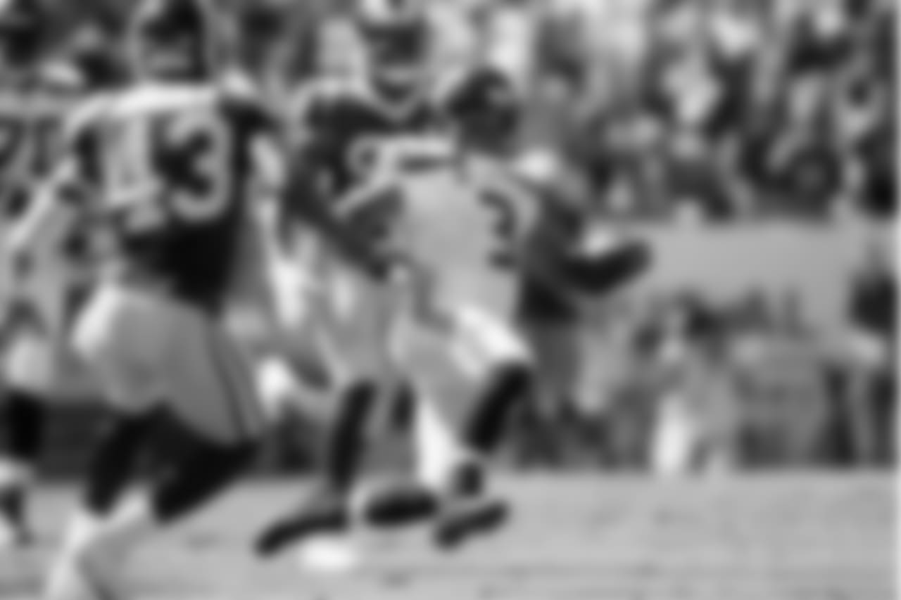Seattle quarterback Russell Wilson slides after scrambling during the first quarter.