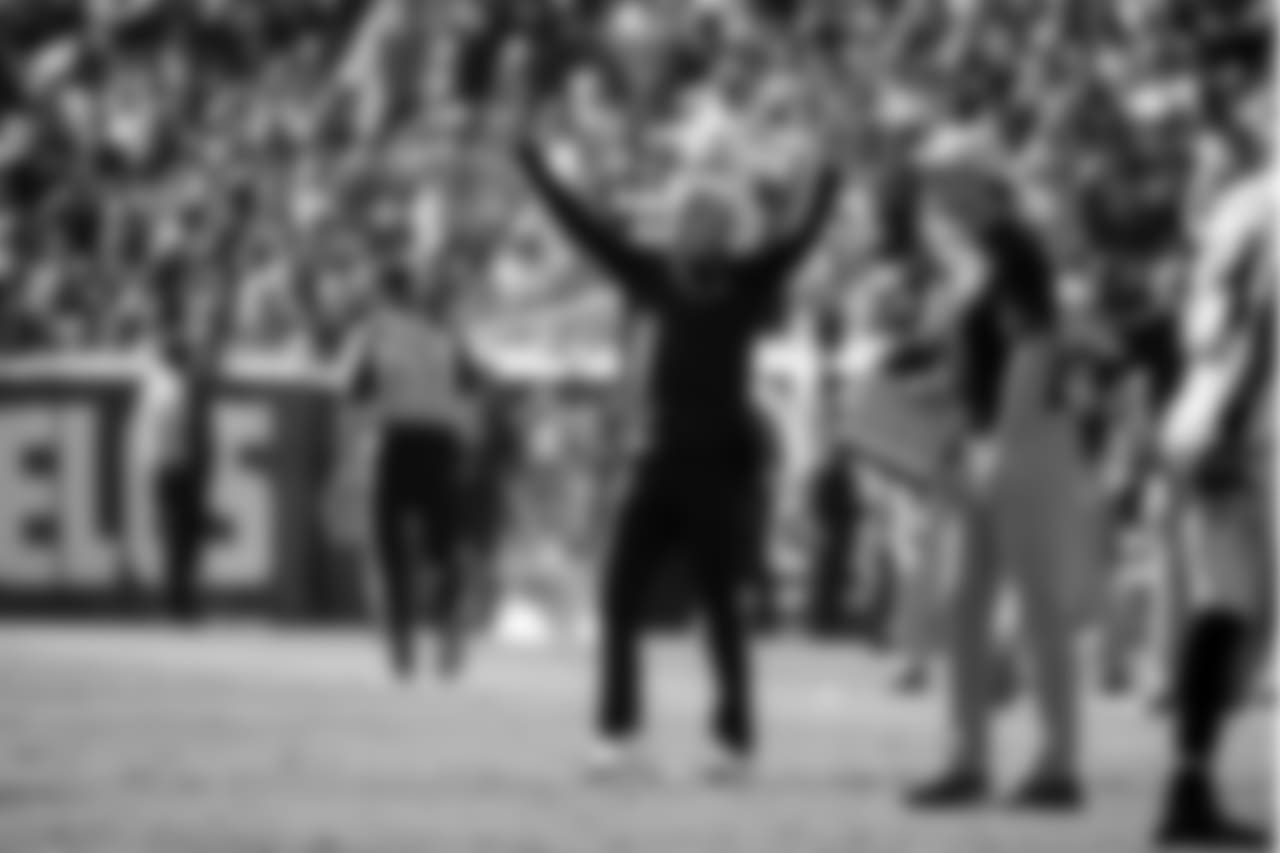 Seahawks coach Pete Carroll celebrates as his defense forced the Rams to punt late in the game.