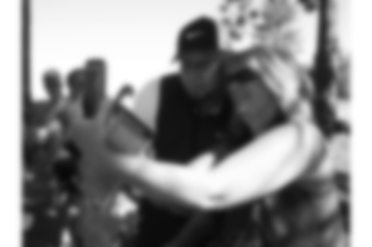 Oakland Raiders Sebastian Janikowski poses for a photo with a fan at the 24th Annual American Century Celebrity Golf Championship on Thursday, July 18, at Edgewood Tahoe Golf Course in South Lake Tahoe, Calif. (AP Photo/Nick Lucero)