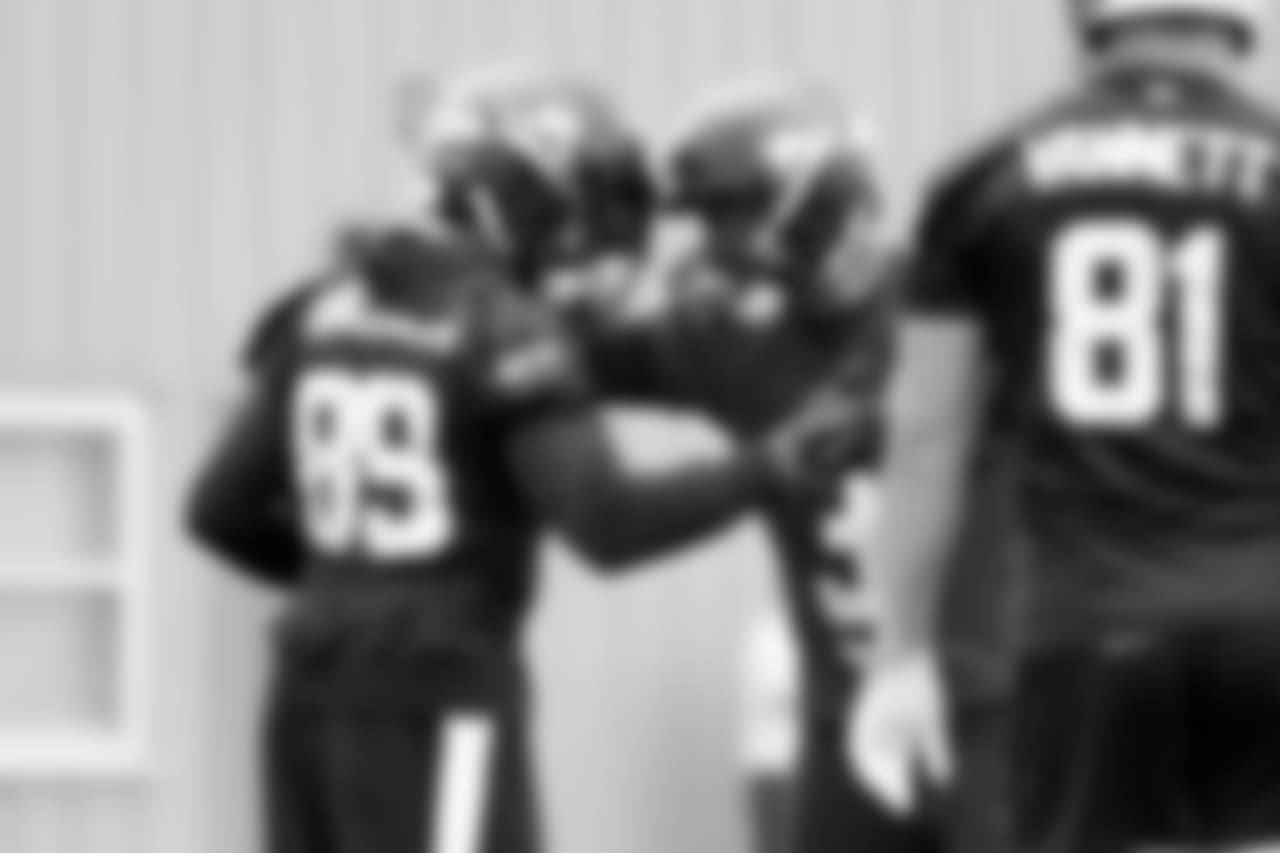 WR Doug Baldwin, left, and QB Russell Wilson, middle