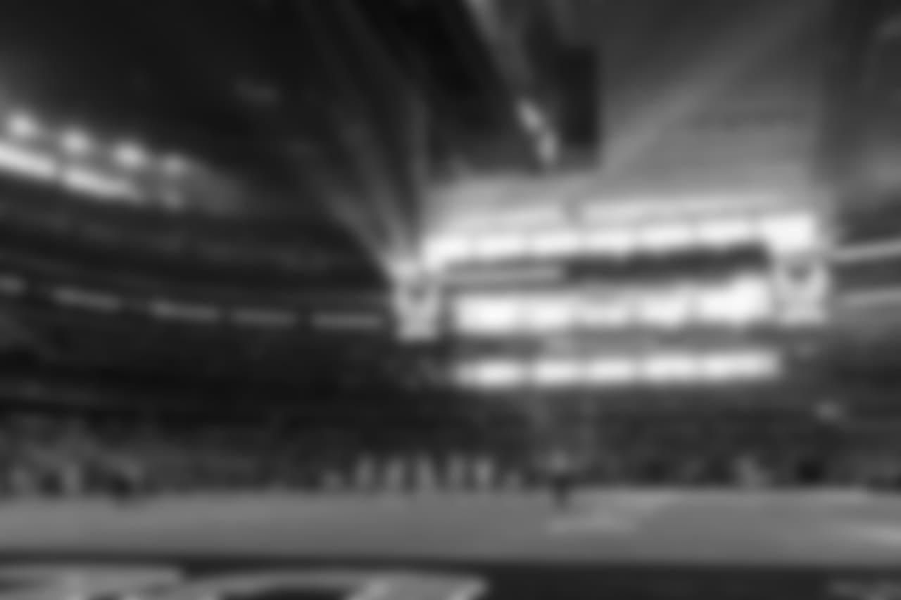 The late winter sun streams through the end zone windows at AT&T Stadium.