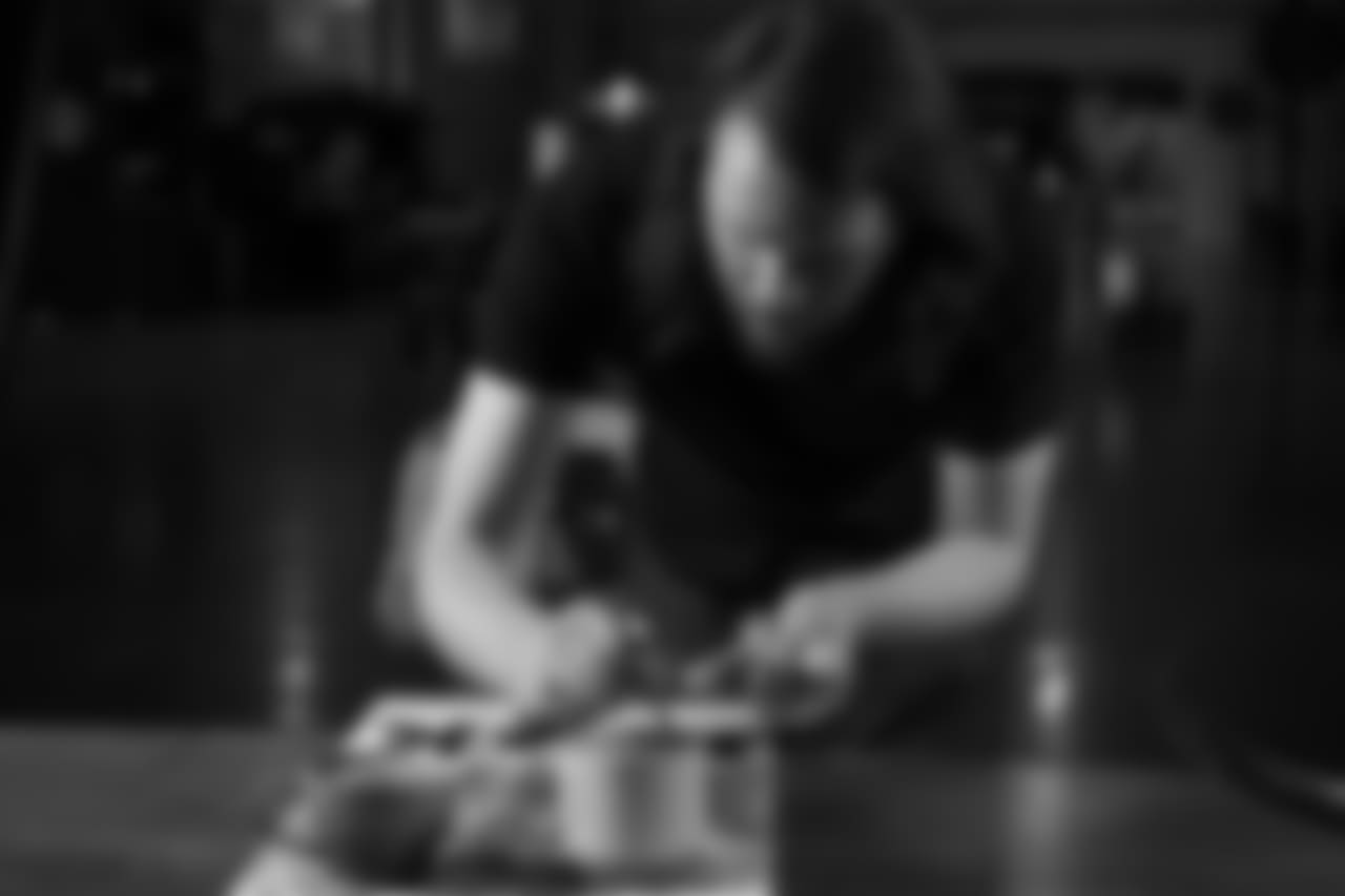 Latte artist Kale Lotton works on a latte logo for the Seahawks schedule release video.