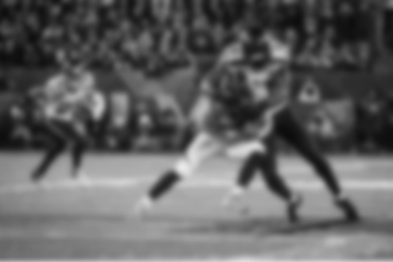 Strong safety Kam Chancellor swallows up Denver receiver Wes Welker, as free safety Earl Thomas lurks.