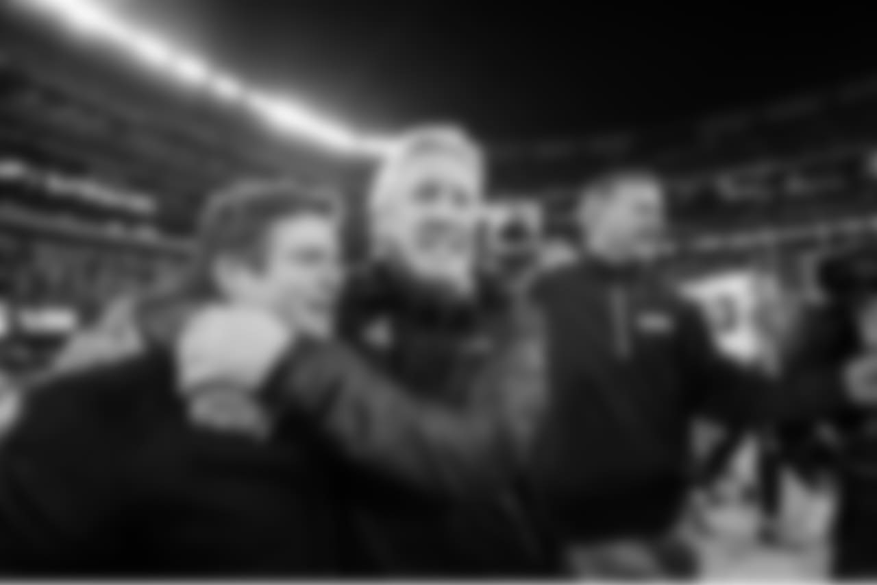 Pete Carroll hugs general manager John Schneider during the two-minute warning.