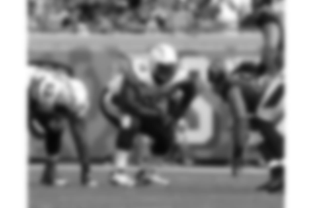 San Diego Chargers' rookie right tackle D.J. Fluker (76) lines up before the snap during a game against the Jacksonville Jaguars at EverBank Field in Jacksonville, Florida, Sunday, October 20, 2013. (AP Photo/Chris Covatta)
