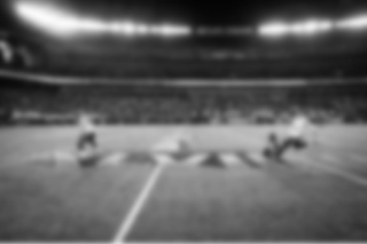 Long snapper Clint Gresham, holder Jon Ryan and kicker Steven Hauschka make one final practice field goal before heading to the locker room.